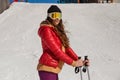 Young beautiful skier with glasses in winter looks