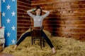 Young beautiful slim girl in the hayloft Royalty Free Stock Photo