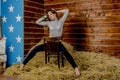 Young beautiful slim girl in the hayloft Royalty Free Stock Photo