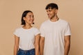 Young beautiful smiling asian woman and stylish handsome smiling man Royalty Free Stock Photo