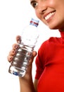 Young beautiful smiling girl with mineral water