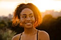 Young beautiful smiling happy curly african woman looking aside Royalty Free Stock Photo