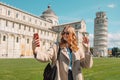 Young beautiful smiling hipster woman in trendy spring clothes. Positive blond female outdoors. Cheerful and happy Royalty Free Stock Photo