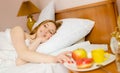 Young beautiful smiling lady waking up and having Royalty Free Stock Photo