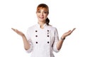 Young beautiful smiling red-haired woman doctor or nurse in white special uniform standing and shrugging with hands