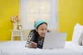 Young beautiful smiling teenage girl using laptop computer Royalty Free Stock Photo
