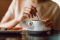 Young beautiful smiling woman enjoying drinking cappuccino coffee cup indoor cafe. Tea or coffee drink Royalty Free Stock Photo