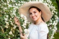 Young beautiful smiling woman with flowers outdoors Royalty Free Stock Photo