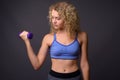 Young beautiful sport woman ready for gym holding dumbbells Royalty Free Stock Photo