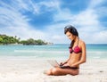 Young, beautiful, sporty and woman relaxing on the beach Royalty Free Stock Photo