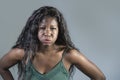 Young beautiful and stressed black African American woman feeling upset and angry gesturing agitated and looking crazy and