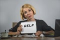 Young beautiful and stressed business woman working overwhelmed and depressed at office laptop computer desk asking for help feeli Royalty Free Stock Photo