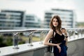 Young beautiful stylish hipster woman drinking coffee in paper Royalty Free Stock Photo