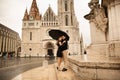 Young beautiful stylish pair of newlyweds walking by the Fisherman`s Bastion in Budapest, Hungary Royalty Free Stock Photo