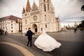 Young beautiful stylish pair of newlyweds walking by the Fisherman`s Bastion in Budapest, Hungary