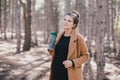 Young regnant woman posing in autumn park Royalty Free Stock Photo