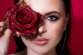 Young beautiful stylish sensual woman with blue eyes and rose. Woman with red lips and rose flower. Fashion beauty Royalty Free Stock Photo