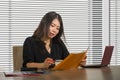 Young beautiful and successful Asian Korean business woman working confident at modern office computer desk in female businesswoma