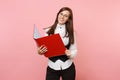 Young beautiful successful brunette business woman in glasses holding red folder for papers document on pink Royalty Free Stock Photo