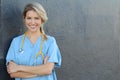 Young beautiful successful female doctor with stethoscope - portrait with copy space