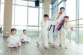 young, beautiful, successful multi ethical kids in karate positi Royalty Free Stock Photo
