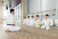 young, beautiful, successful multi ethical kids in karate positi Royalty Free Stock Photo