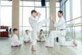 young, beautiful, successful multi ethical kids in karate positi Royalty Free Stock Photo