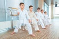 Young, beautiful, successful multi ethical kids in karate position Royalty Free Stock Photo