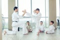 Young, beautiful, successful multi ethical kids in karate position Royalty Free Stock Photo