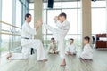 Young, beautiful, successful multi ethical kids in karate position Royalty Free Stock Photo