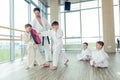 Young, beautiful, successful multi ethical kids in karate position Royalty Free Stock Photo