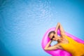 Young Beautiful Suntanned Woman relaxing next to a Swimming Pool Royalty Free Stock Photo