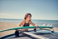 Beautiful surfer girl at the beach getting ready for surfing Vac Royalty Free Stock Photo