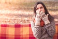 Young beautiful surprised woman in a knitted sweater and gloves Royalty Free Stock Photo