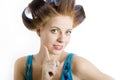 Young beautiful surprized woman with hair curlers Royalty Free Stock Photo