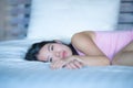 Young beautiful and sweet Asian Chinese woman lying playful and comfortable in bed relaxed and happy at her cozy bedroom smiling c Royalty Free Stock Photo