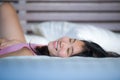 Young beautiful and sweet Asian Chinese woman lying playful and comfortable in bed relaxed and happy at her cozy bedroom smiling c Royalty Free Stock Photo