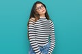 Young beautiful teen girl wearing casual clothes and glasses relaxed with serious expression on face Royalty Free Stock Photo