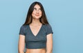 Young beautiful teen girl wearing casual crop top t shirt smiling looking to the side and staring away thinking Royalty Free Stock Photo