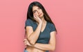 Young beautiful teen girl wearing casual crop top t shirt thinking looking tired and bored with depression problems with crossed Royalty Free Stock Photo