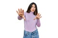 Young beautiful teen girl wearing turtleneck sweater doing stop gesture with hands palms, angry and frustration expression Royalty Free Stock Photo