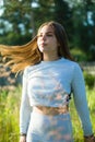 Young teenage girl posing outdoors in the village Royalty Free Stock Photo