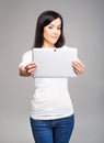 Young and beautiful teenager girl holding a tablet Royalty Free Stock Photo