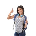 Young beautiful and trendy latin student girl carrying backpack smiling happy and confident