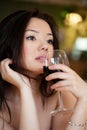 Young beautiful trendy woman in bar. Beautiful Asian girl in a p Royalty Free Stock Photo