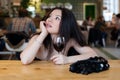 Young beautiful trendy woman in the bar. Beautiful Asian girl in Royalty Free Stock Photo