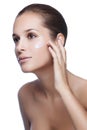 Young beautiful woman applying moisturize cream Royalty Free Stock Photo