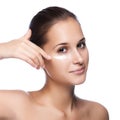 Young beautiful woman applying moisturize cream Royalty Free Stock Photo