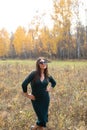 Young beautiful woman in autumn forest