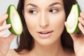 Young beautiful woman with avocado closeup